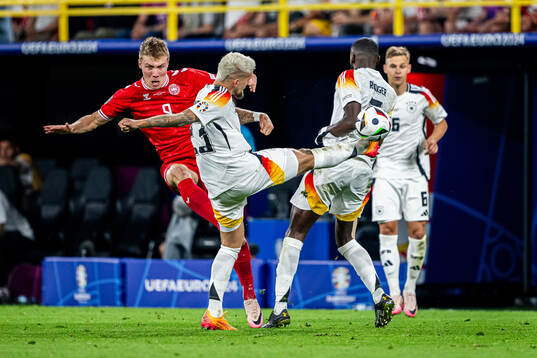 Rasmus Højlund of Denmark and Robert Andrich and Antonio
