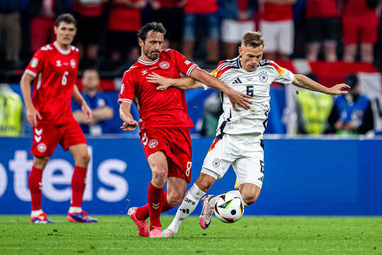 Thomas Delaney of Denmark and Joshua Kimmich of Germany
