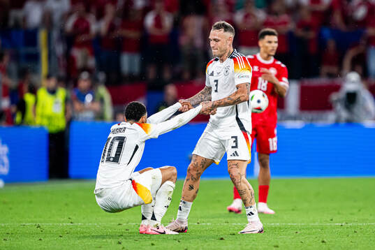 Jamal Musiala and David Raum of Germany