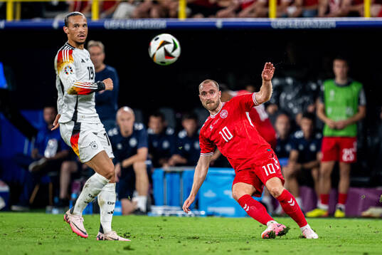 Leroy Sane of Germany and Christian Eriksen of Denmark