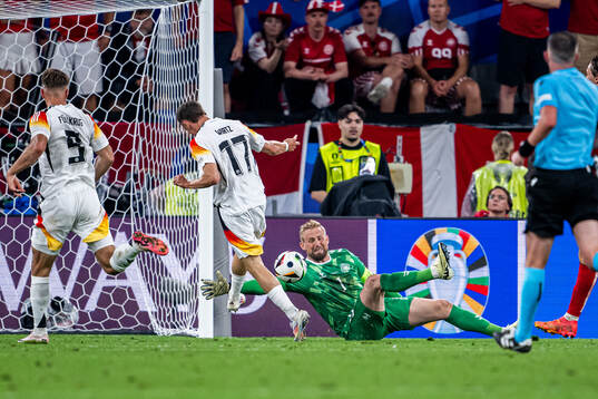 Florian Wirtz of Germany and goalkeeper Kasper Schmeichel