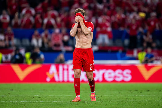 Joachim Andersen of Denmark looks dejected