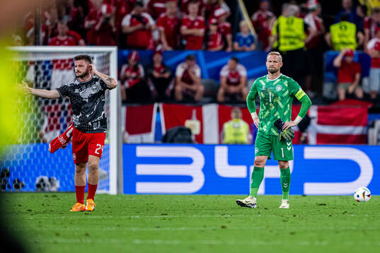Goalkeeper Kasper Schmeichel of Denmark looks dejected