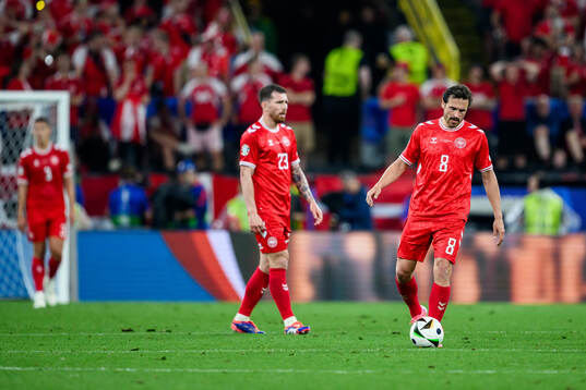 Pierre-Emilie Højbjerg and Thomas Delaney of Denmark look