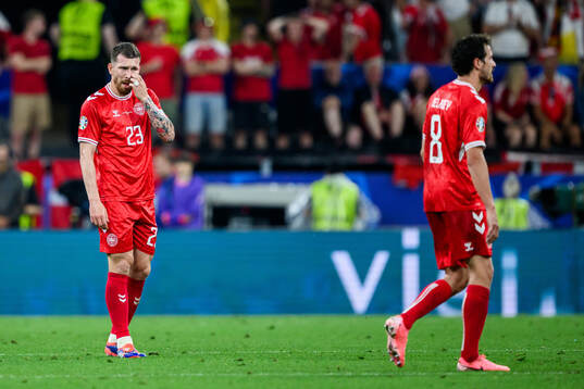 Pierre-Emilie Højbjerg and Thomas Delaney of Denmark look