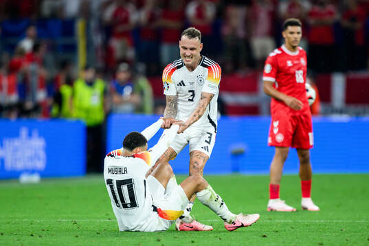 Jamal Musiala and David Raum of Germany