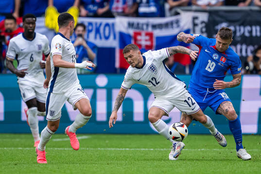 Kieran Trippier of England and Juraj Kucka of Slovakia