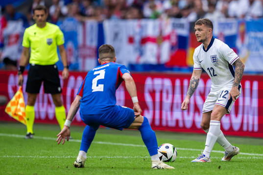 Peter Pekarik of Slovakia and Kieran Trippier of England