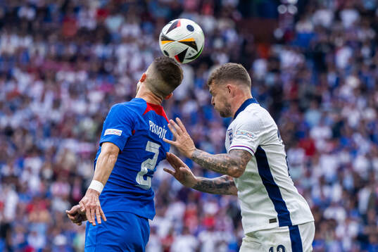 Peter Pekarik of Slovakia and Kieran Trippier of England