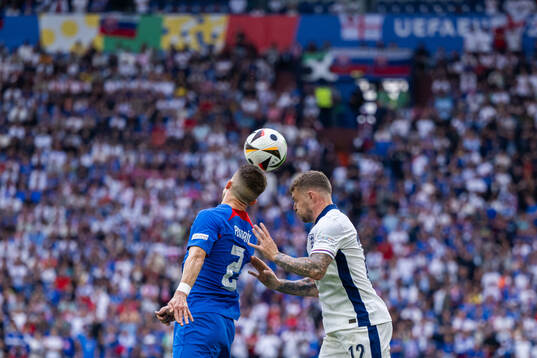 Peter Pekarik of Slovakia and Kieran Trippier of England