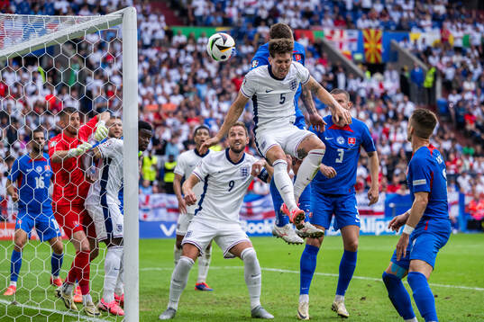 John Stones of England and Juraj Kucka of Slovakia