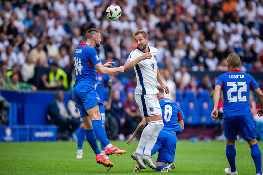 Milan Skriniar of Slovakia and Harry Kane of England