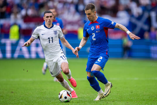 Phil Foden of England and Peter Pekarik of Slovakia