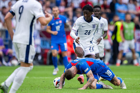 Kobbie Mainoo of England and Juraj Kucka of Slovakia