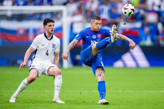 Declan Rice of England and Juraj Kucka of Slovakia