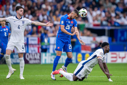 Ivan Schranz of Slovakia and Declan Rice and Marc Guehi of