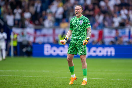 Goalkeeper Jordan Pickford of England celebrates