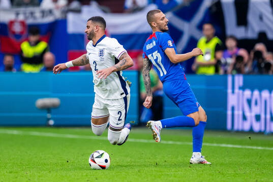 Kyle Walker of England and Lukas Haraslin of Slovakia