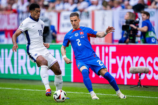 Jude Bellingham of England and Peter Pekarik of Slovakia