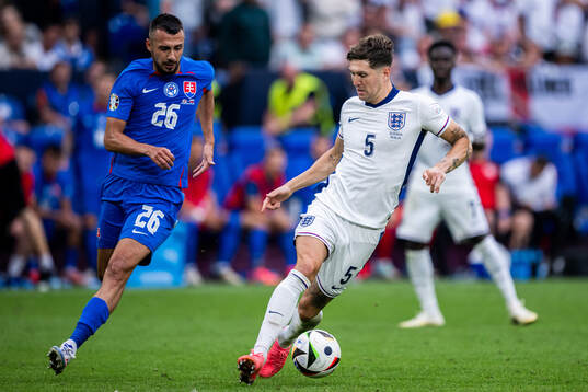 Ivan Schranz of Slovakia and John Stones of England