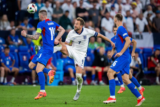 Milan Skriniar of Slovakia and Harry Kane of England