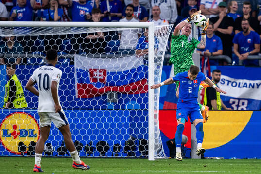 Peter Pekarik of Slovakia and goalkeeper Jordan Pickford of