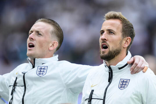 goalkeeper Jordan Pickford and Harry Kane of England
