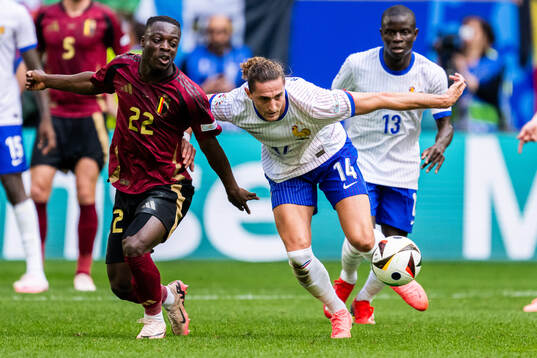 Jeremy Doku of Belgium and Adrien Rabiot of France