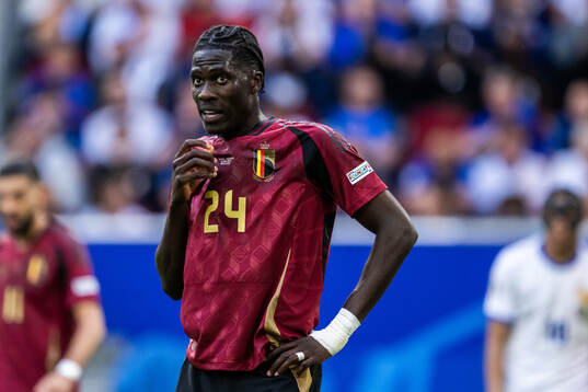 Amadou Onana of Belgium looks dejected