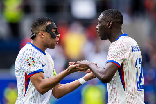 Kylian Mbappé and Randal Kolo Muani of France celebrate