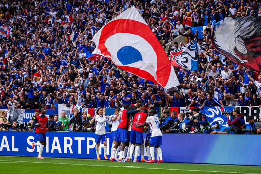 Randal Kolo Muani of France celebrates with the team