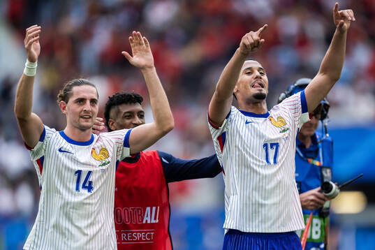 Adrien Rabiot and William Saliba of France celebrate