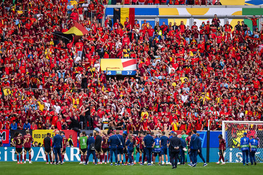 Players of Belgium with their supporters