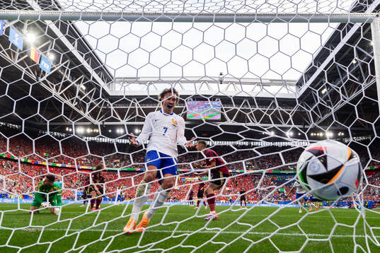 Antoine Griezmann of France and Jan Vertonghen of Belgium