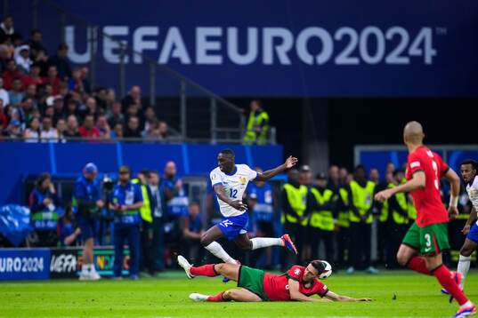 Randal Kolo Muani of France and Joao Palhinha of Portugal