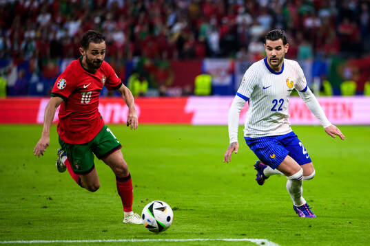 Bernardo Silva of Portugal and Theo Hernandez of France