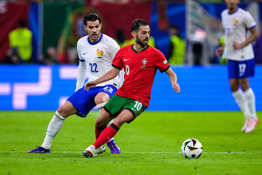 Theo Hernandez of France and Bernardo Silva of Portugal