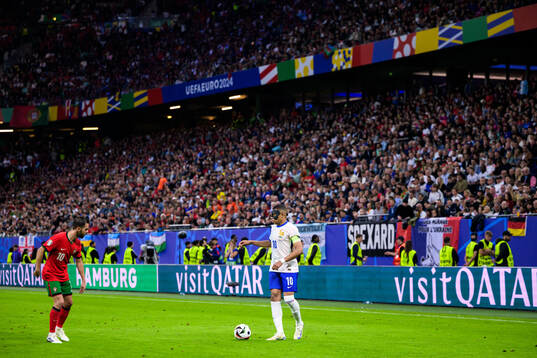 Bernardo Silva of Portugal and Kylian Mbappé of France
