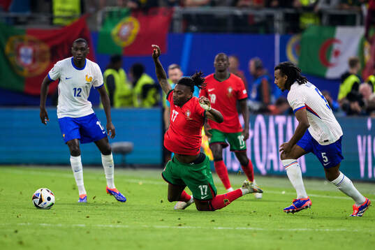 Rafael Leao of Portugal and Jules Koundé of France