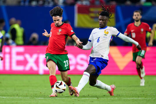 Vitinha of Portugal and Eduardo Camavinga of France