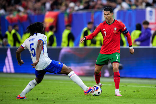 Marcus Thuram of France and Cristiano Ronaldo of Portugal