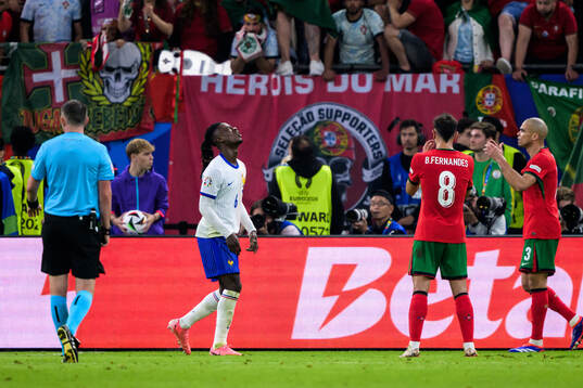 Eduardo Camavinga of France looks dejected