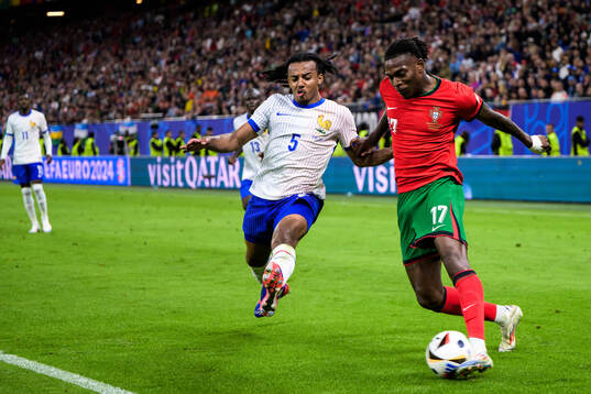 Jules Koundé of France and Rafael Leao of Portugal