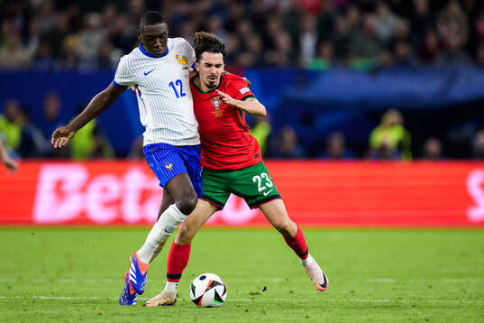 Randal Kolo Muani of France and Vitinha of Portugal