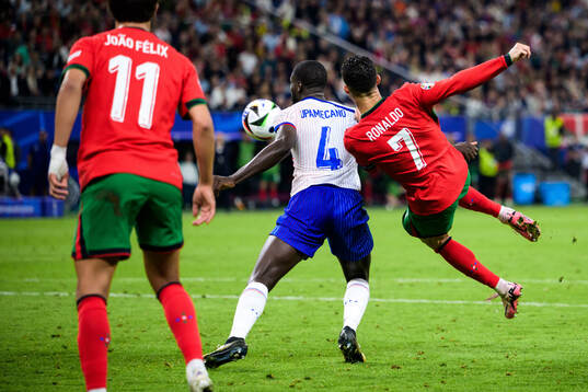 Dayot Upamecano of France and Cristiano Ronaldo of Portugal