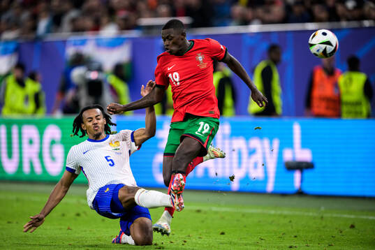 Jules Koundé of France and Nuno Mendes of Portugal