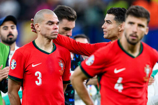 Pepe and Cristiano Ronaldo of Portugal look dejected