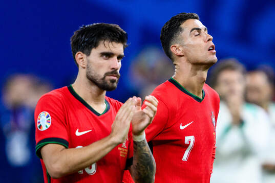 Matheus Nunes and Cristiano Ronaldo of Portugal look