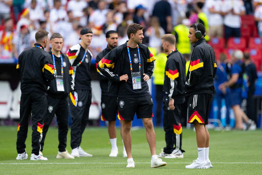 Thomas Muller and Jamal Musiala of Germany