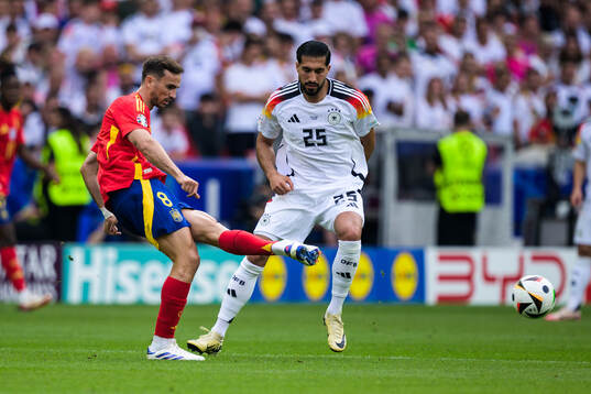Fabian Ruiz Pena of Spain and Emre Can of Germany
